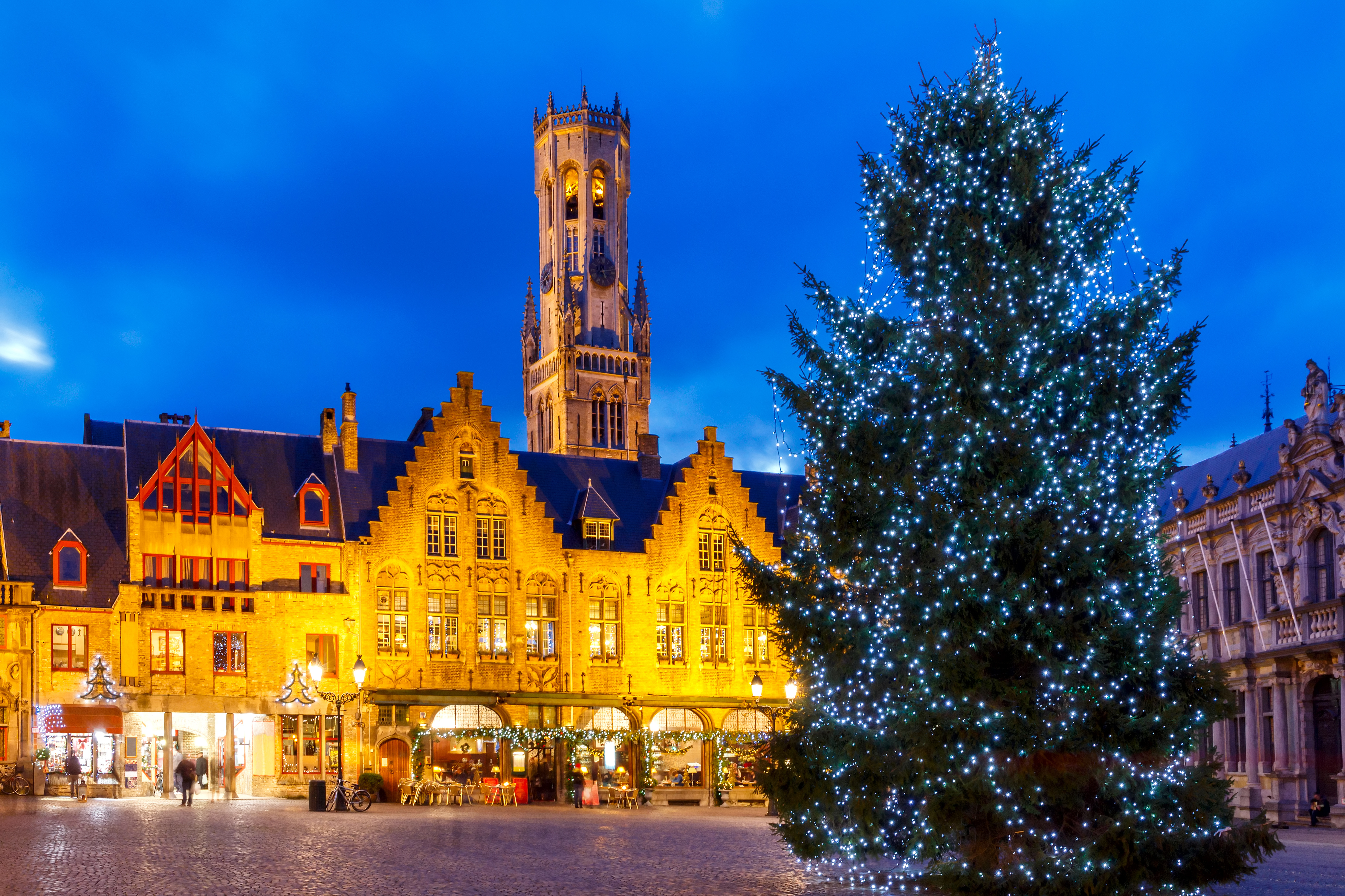Festive illuminations and Christmas tree on the Burg Square in the Belgian city of Bruges.