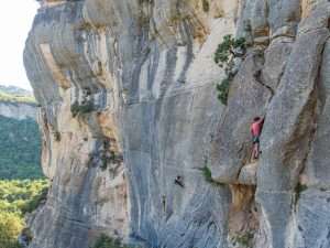 Climber resting in the crack in Buoux, France