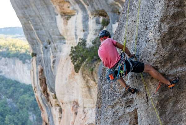 Climber removing the rope in Buoux, France